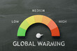 Global warming indicator on a blackboard, with levels from low to high. Environmental concept. 3D Rendering