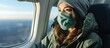 Blonde woman in medical mask sitting in the plane by the window