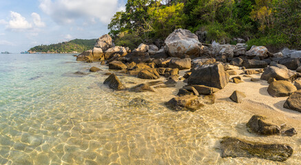 Wall Mural - Scenic empty tropical paradise Freedom Beach on Koh Tao island with stones and rocks on shore and in pure crystal water in sunny morning - best travel destinations for vacation in Thailand