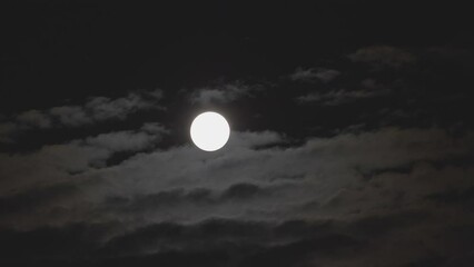 Wall Mural - Night clouds passing fast under the full moon