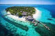 vu aérienne d'un atoll polynésien avec complexe hôtelier et plage privée