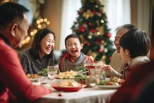 Asian Family Of 70 Year Old Grand Parents, 40 Year Old Parents Having A Christmas Lunch In Daylight