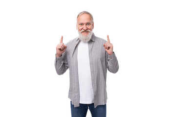 Wall Mural - well-groomed gray-haired senior man with a beard and mustache feels healthy