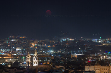 Wall Mural - Full pink moon over Jerusalem city