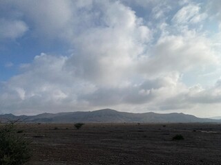 Blue clouds in the sky over the mountain