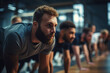 Group of sporty men in row workout together at gym.