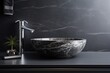 A bathroom sink with a black marble bowl. Scandinavian home interior design of modern living home.