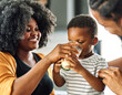 © Lumos sp - child family kitchen boy son mother father drink breakfast milk healthy drinking food eating glass home black african american father man together love cute childhood