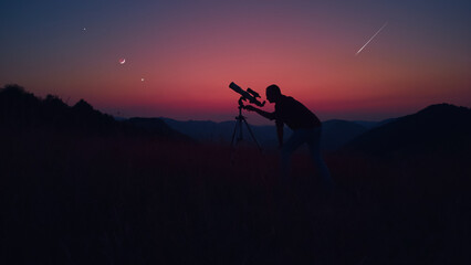 Wall Mural - astronomer looking at the stars, planets, moon and celestial objects with a telescope.