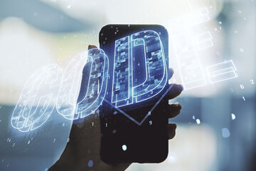 Aufkleber - Creative Code word sign and hand with mobile phone on background, international software development concept. Multiexposure