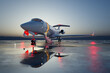 Luxurious Private Jet Poised for Night Departure on Reflective Tarmac