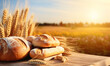 A fragrant loaf of bread on a wooden table with a picturesque wheat field in the background of a rural landscape.