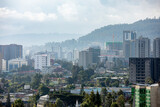 Fototapeta Sawanna - High angle view of Addis Ababa, capital city of Ethiopia with mountains in the background.