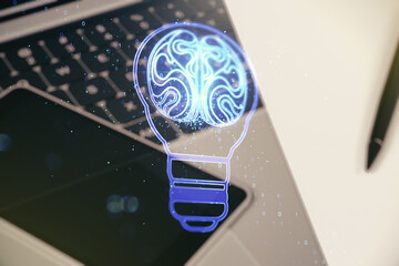 Poster - Double exposure of creative light bulb hologram with human brain on laptop background, idea and brainstorming concept