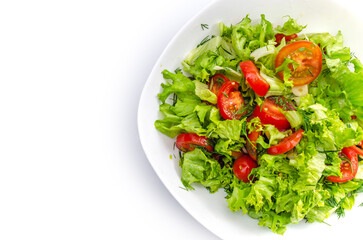 Wall Mural - White bowl of chopped vegetables - dill, tomatoes, lettuce. White background, isolated, copy space.