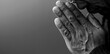 © herlanzer - man praying to god on gray black background with people stock image stock photo