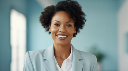 Poster - Close up portrait of a smiling businesswoman in suit standing against office background.