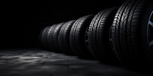 New Car Tires In A Row, Low Key, On Black Background