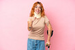 © luismolinero - Young caucasian woman wearing neck brace isolated on pink background surprised and pointing front