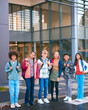 © Monkey Business - Portrait Showing Class Of Secondary Or High School Pupils Standing Outside School Building