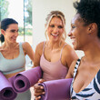 © Monkey Business - Three Mature Female Friends In Fitness Clothing Meeting At Gym Or Yoga Class