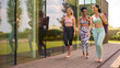 © Monkey Business - Three Mature Female Friends Outdoors In Fitness Clothing Carrying Exercise Mats At Gym Or Yoga Class