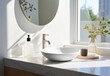 Minimal design bathroom white round ceramic washbasin with tap and mirror near window on marble counter top. Minimalist modern home interior design of modern bathroom.