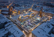 © tomeyk - Night view of snow covered Main Square with Christmas Fairs in Krakow, Poland