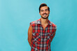 Man attractive isolated guy friendly blue shirt happy smile travel plaid background crossed confident trendy arm
