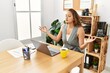 © Krakenimages.com - Young beautiful hispanic woman business worker doing yoga exercise at office