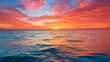 A stunning sunset over the ocean the sky ablaze with oranges and pinks.