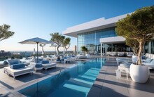 A Modern Superior Hotel Pool And Superior Outdoor Sofas At A Sunny Day