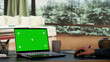 © DC Studio - Rich entrepreneur rests at his outstanding alpine villa, viewing greenscreen projection on his laptop. International director interacts on pc with blank chromakey display, luxurious daily living.