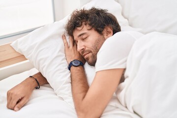 Wall Mural - Young hispanic man lying on bed sleeping at bedroom