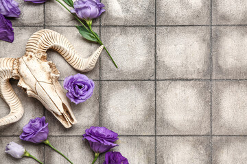 Wall Mural - Skull of sheep with beautiful eustoma flowers on grey tile background