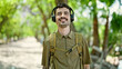© Krakenimages.com - Young hispanic man tourist wearing backpack and headphones at park