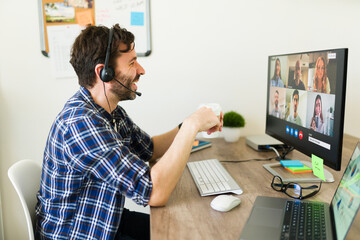 Wall Mural - Happy man working as a manager having a video call