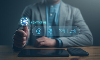 Fototapete - Contact us or Customer support hotline, people connect, Businessman using tablet and smartphone and touching on virtual screen contact icons (email, address, live chat, telephone). Customer service