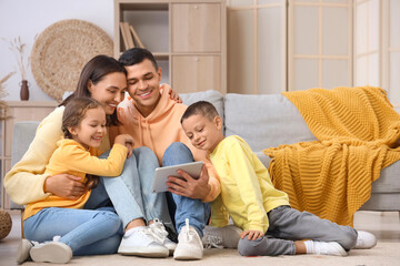 Sticker - Happy family using tablet computer at home