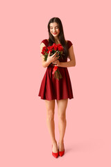 Sticker - Happy young woman with kiss marks on her face and bouquet of roses on pink background