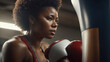 Close-up of an athletic and beautiful black woman boxing. Woman hits a punching bag. Female representation. Black History Month