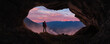 Adventurous Man Hiker standing in a cave. River and Mountains in background. Adventure Composite 3d Rendering