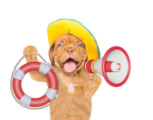 Poster - Happy mastiff puppy wearing summer hat screaming into a megaphone and showing lifebuoy. Isolated on white background