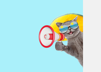 Aufkleber - Happy cat wearing mirrored sunglasses and summer hat talks into megaphone and looks from behind empty white banner. Isolated on blue background
