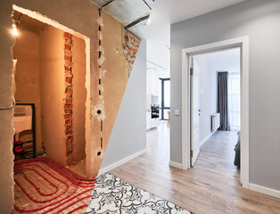 Wall Mural - Comparison of old apartment before restoration and new renovated flat with modern interior design. Apartment with underfloor heating pipes before and after renovation.