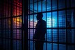 Silhouette of a man in a dark solitary confinement cell. Man in prison. Hope for freedom