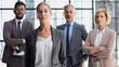 © Katsiaryna - business woman with crossed arms against the background of a business team