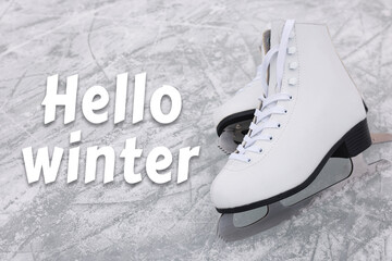 Wall Mural - Hello winter. Pair of figure skates on ice