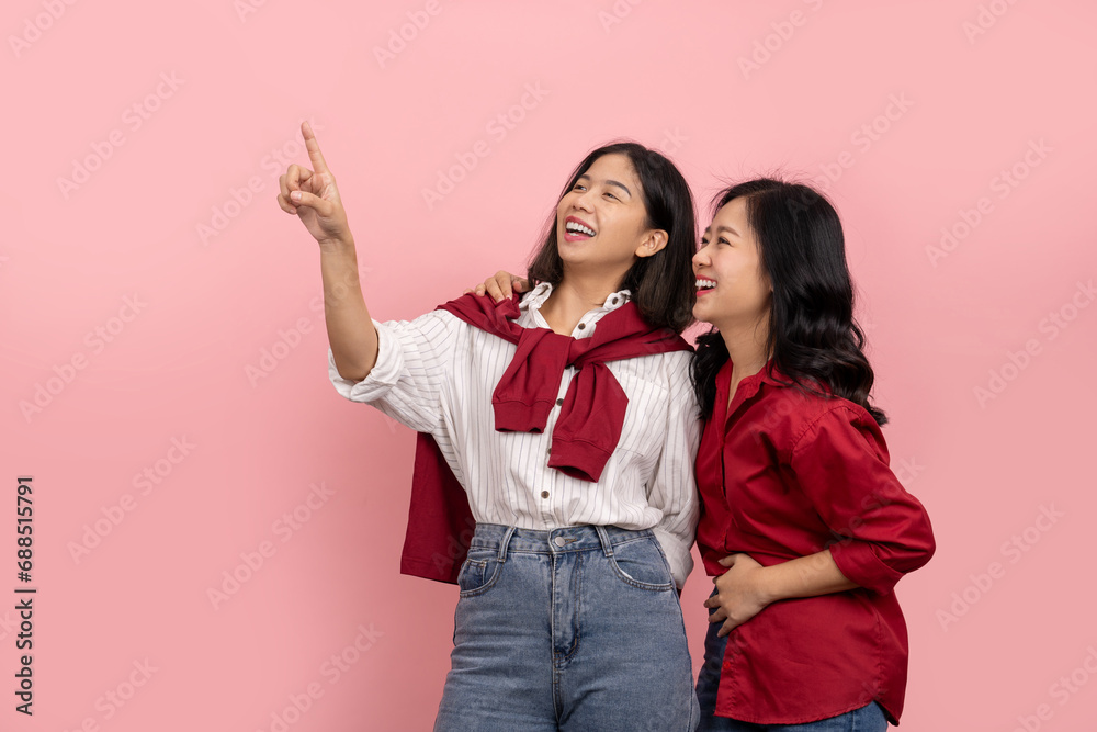 Attractive Asian woman wearing jeans and red shirt is smiling and ...
