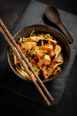 Poster - Fried noodles with chicken and vegetables.